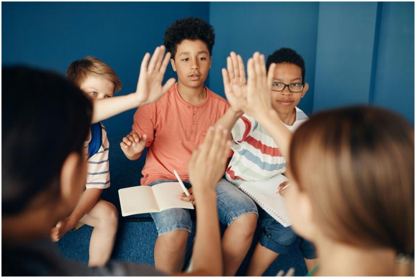 Group of diverse kids collaborating and learning t