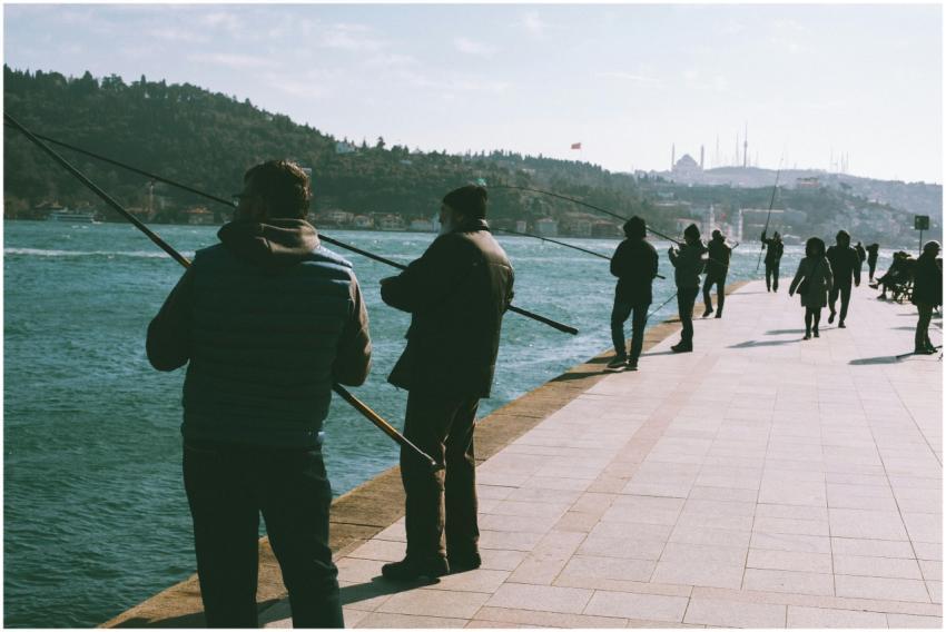 Group of people fishing at the Bosphorus Strait in