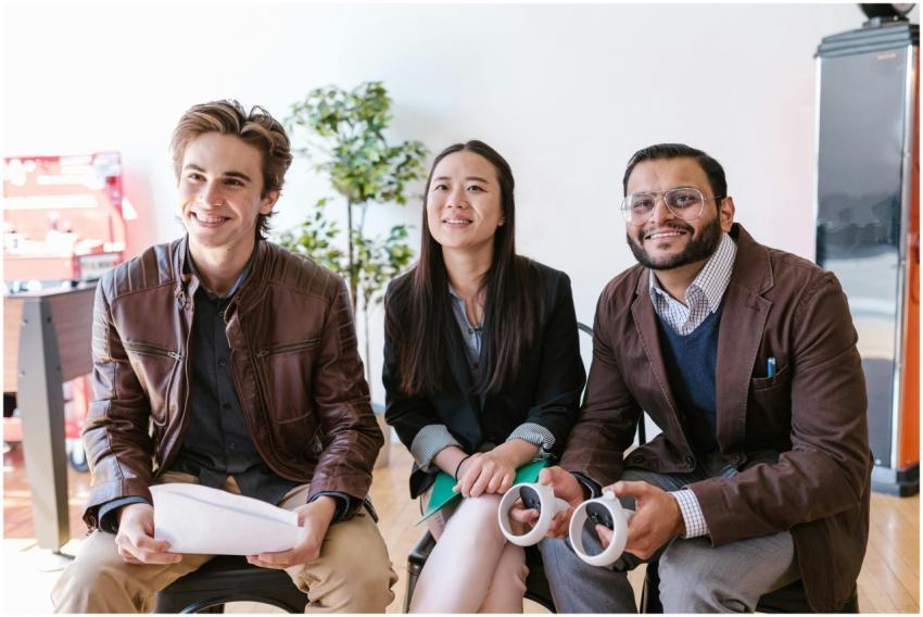 Young entrepreneurs seated together, engaged in a