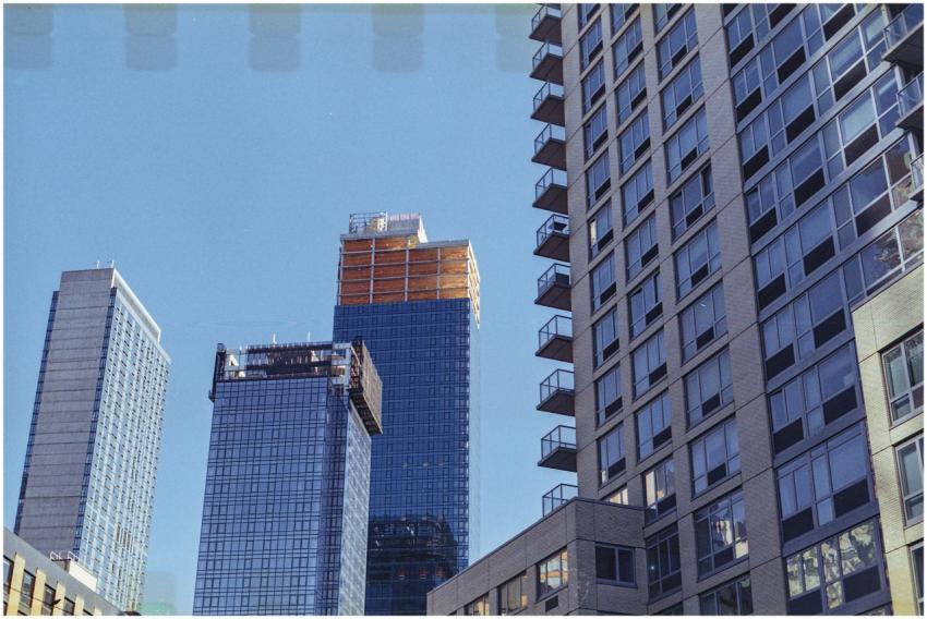A vibrant cityscape of modern skyscrapers under a