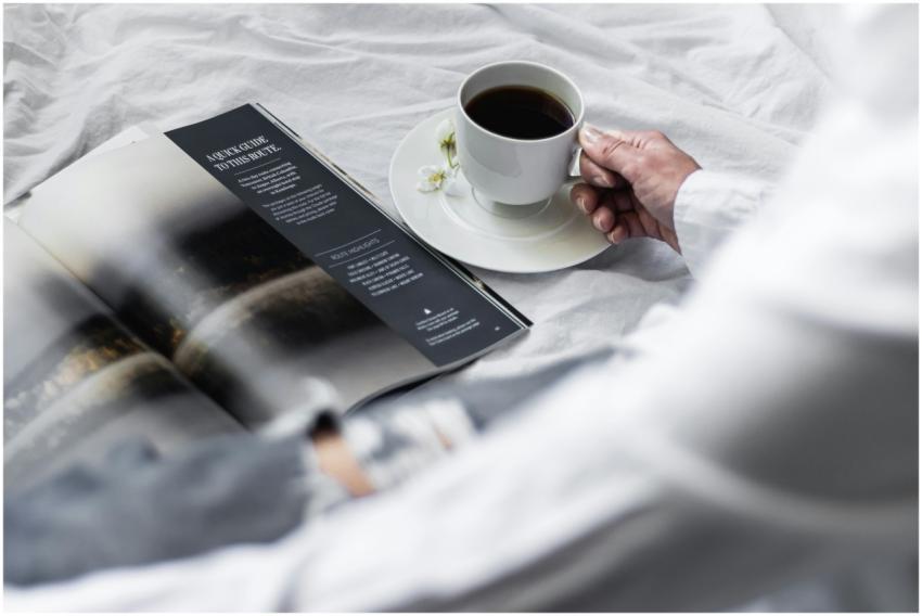 A serene morning scene with black coffee and a mag