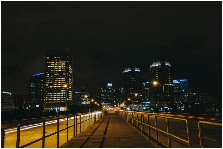Vibrant cityscape at night with illuminated buildi
