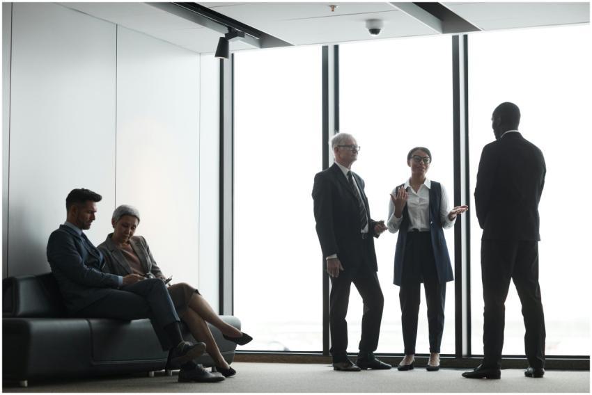 Corporate professionals in discussion during a mee