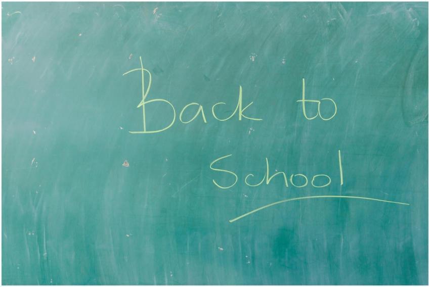 Green chalkboard with 'Back to School' written in