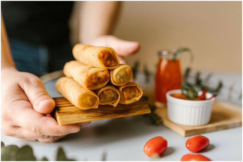 Close-up of crispy spring rolls served with dippin