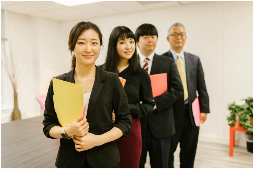 A group of business professionals standing in an o