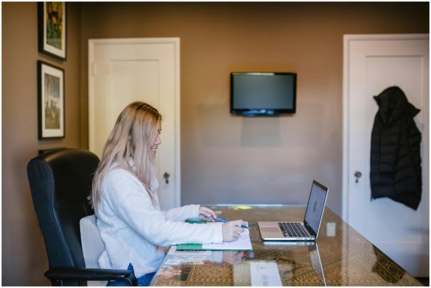 Woman focused on laptop during remote work from ho
