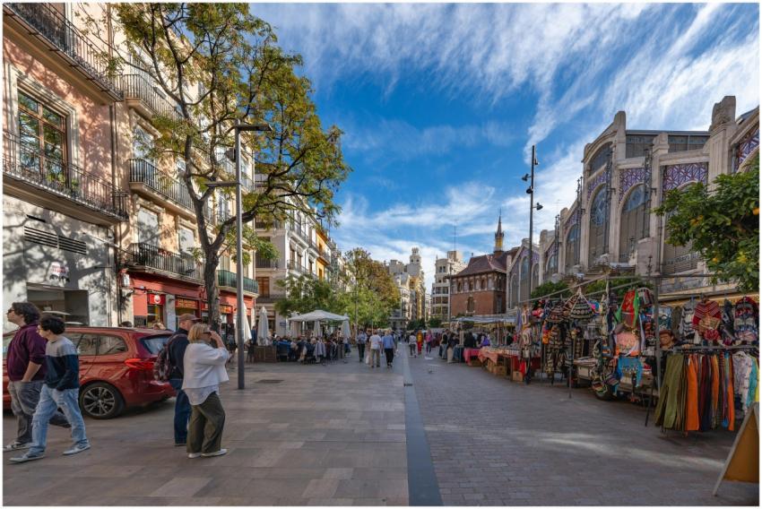 Lively street market scene in Valencia's historic