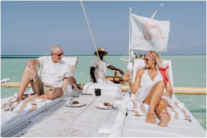 Elderly couple enjoying a luxurious sailboat exper