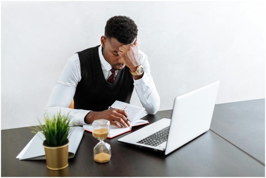 Businessman in office focusing on work with laptop