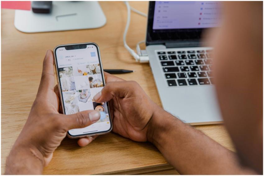 Close-up of a person working on a smartphone while