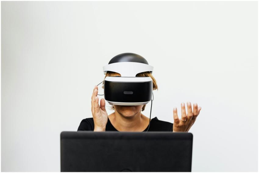 Woman wearing VR headset interacts with virtual en