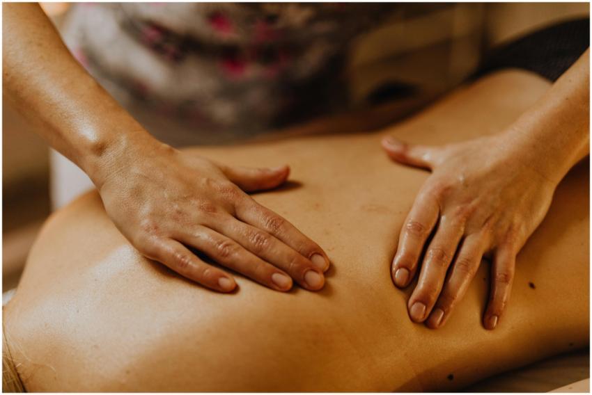 Close-up of hands giving a soothing back massage i