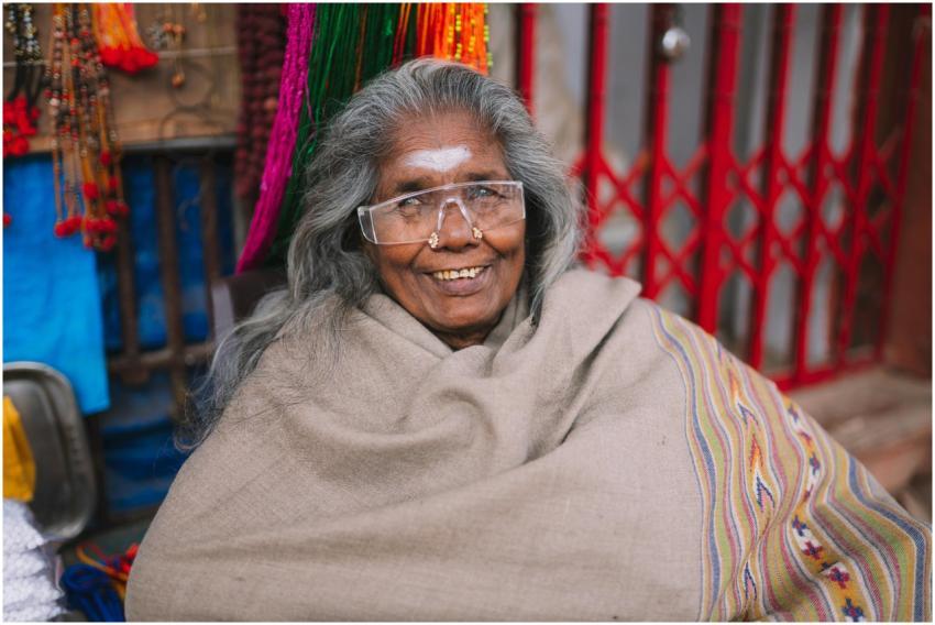 Elderly woman with glasses and traditional shawl s