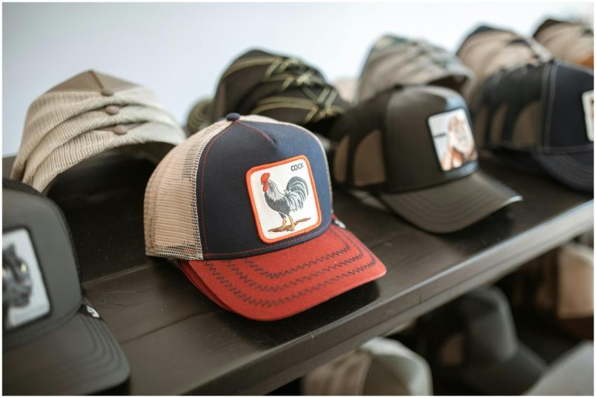 Collection of fashionable graphic caps displayed o