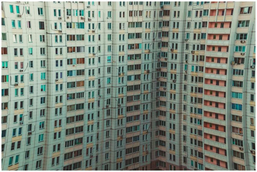 A modern high-rise building with a detailed view o