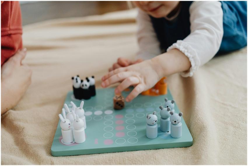 Child enjoying a board game indoors. Perfect candi
