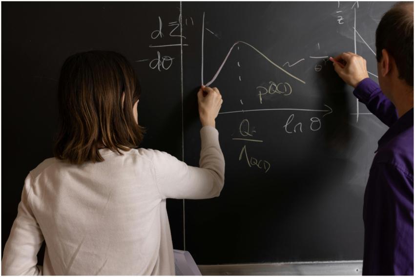 Teachers collaborating on mathematical equations a