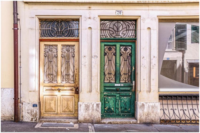 Charming vintage wooden doors with intricate ironw