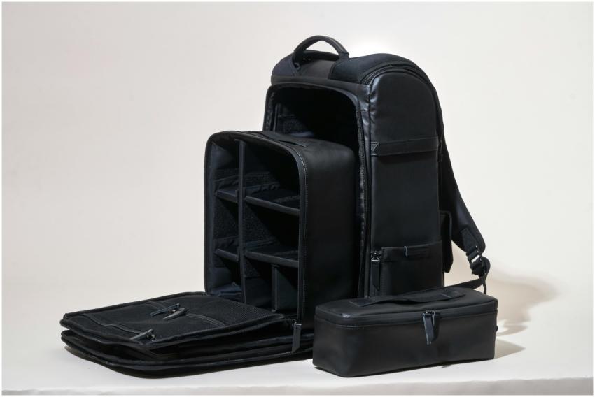 Sleek black leather camera bag showcasing compartm