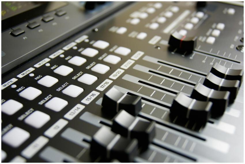 Detailed view of audio mixer sliders and buttons f