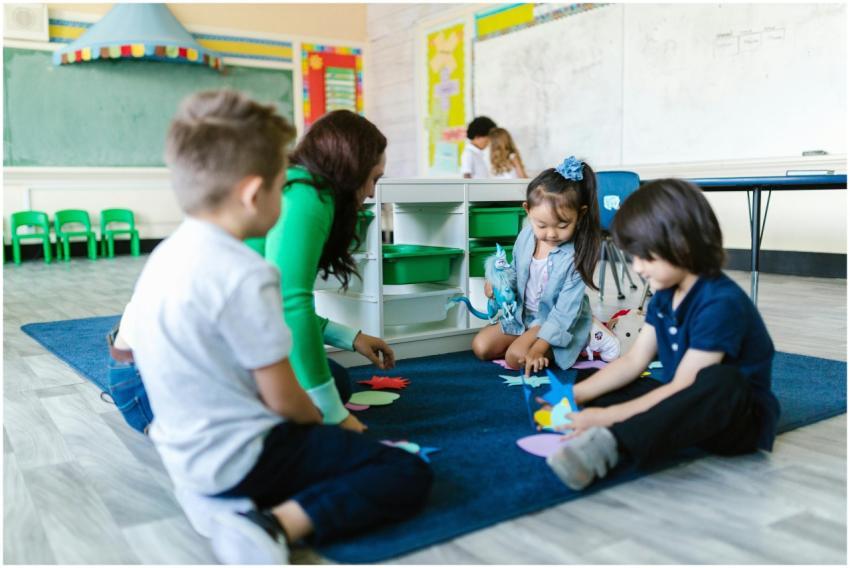 Kids and teacher in a kindergarten classroom engag
