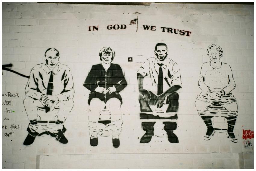 Satirical street art mural depicting political fig