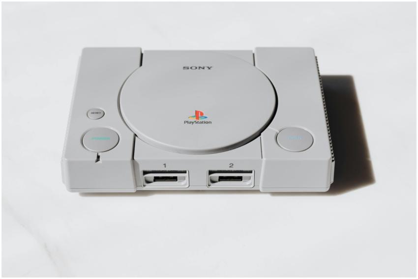 A classic Sony PlayStation console captured on a w