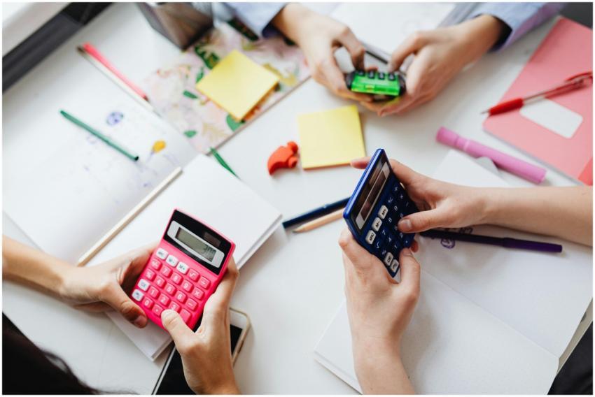 Children using vibrant calculators to solve math p