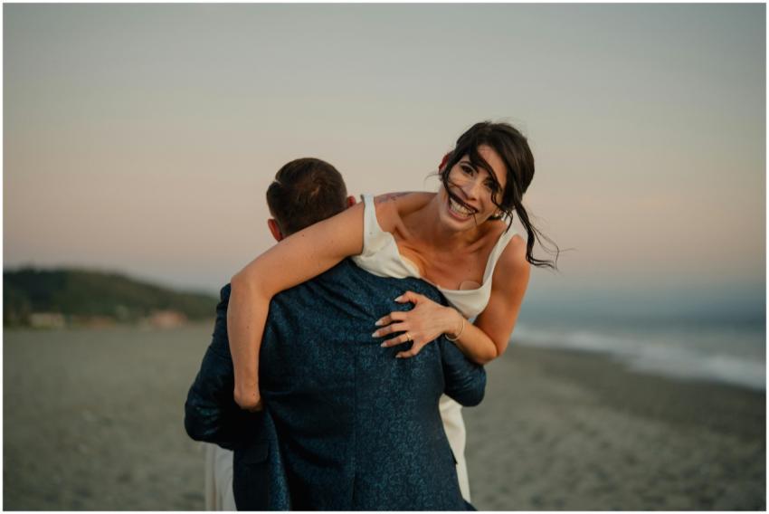 Joyful Couple Embracing Beach