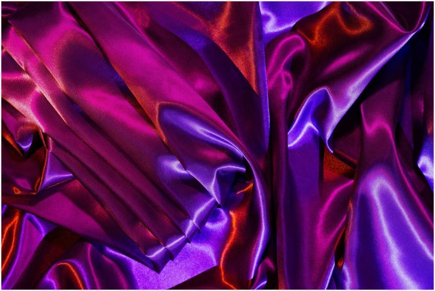 Close-up of vibrant purple and pink satin fabric w