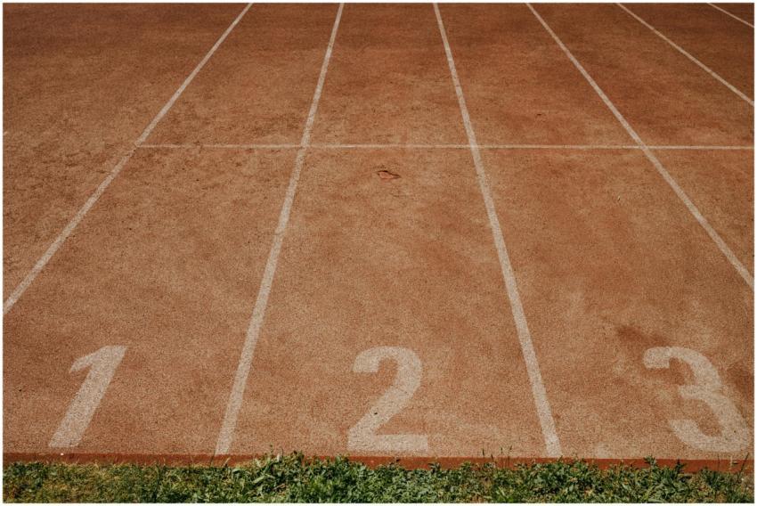 Outdoor sports track with lanes numbered 1 to 3, r
