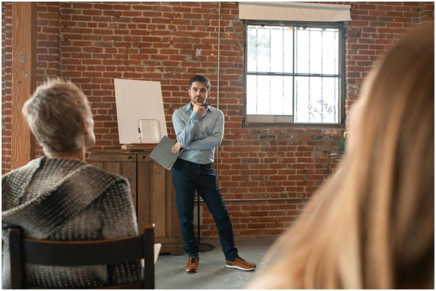 Teacher engaging adult students in a classroom dis