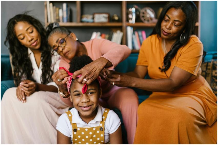 Three generations of women sharing a tender moment