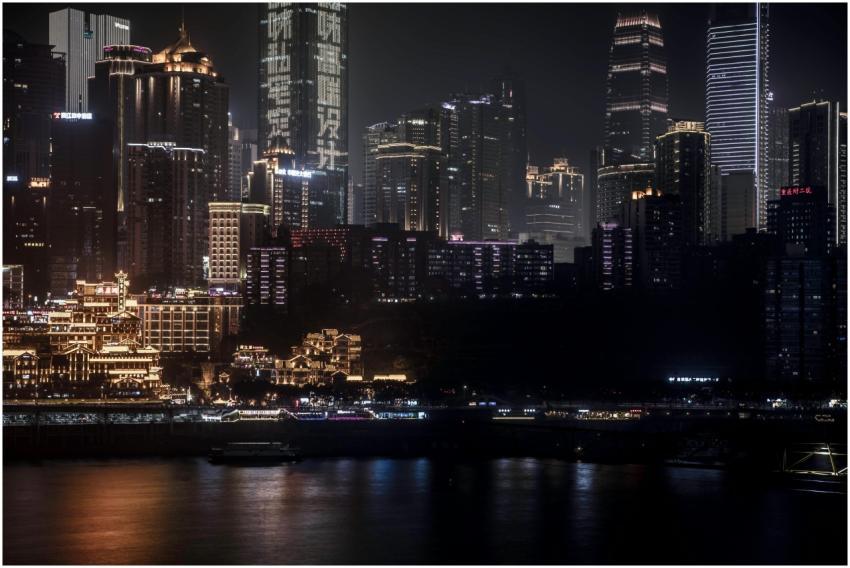 Illuminated Chongqing skyline at night showcasing