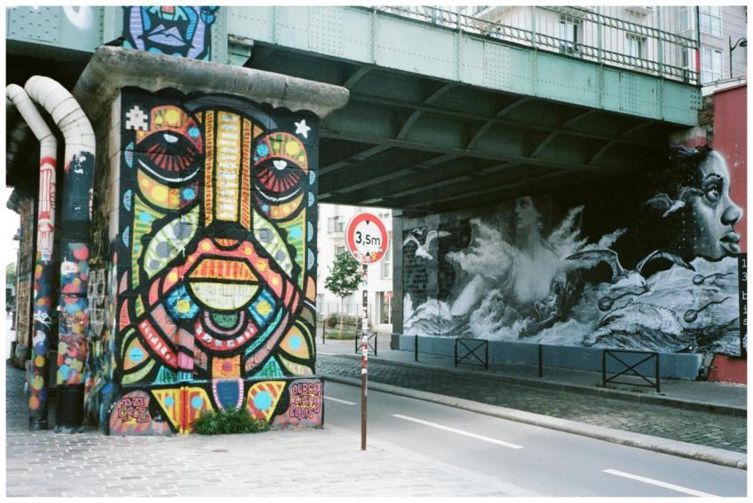 Dynamic street art depicting colorful and monochro