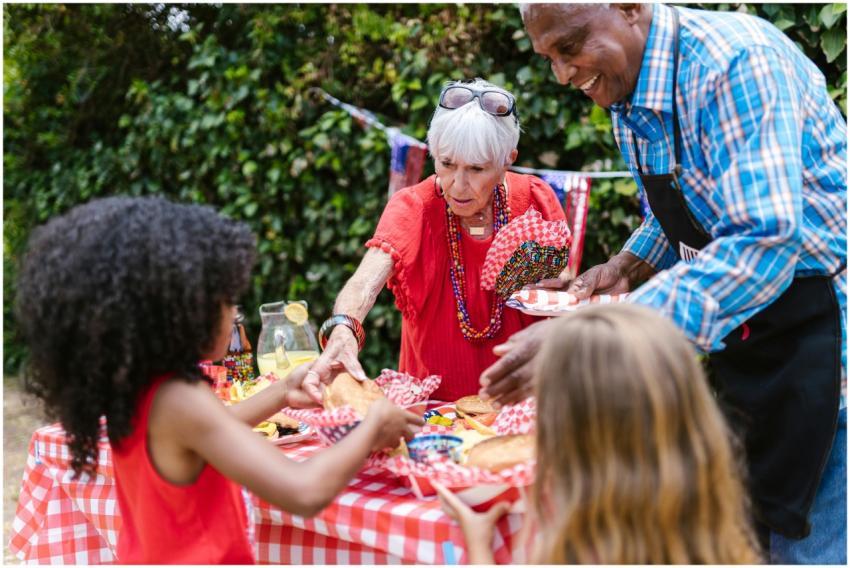 A vibrant family gathering outdoors with grandpare