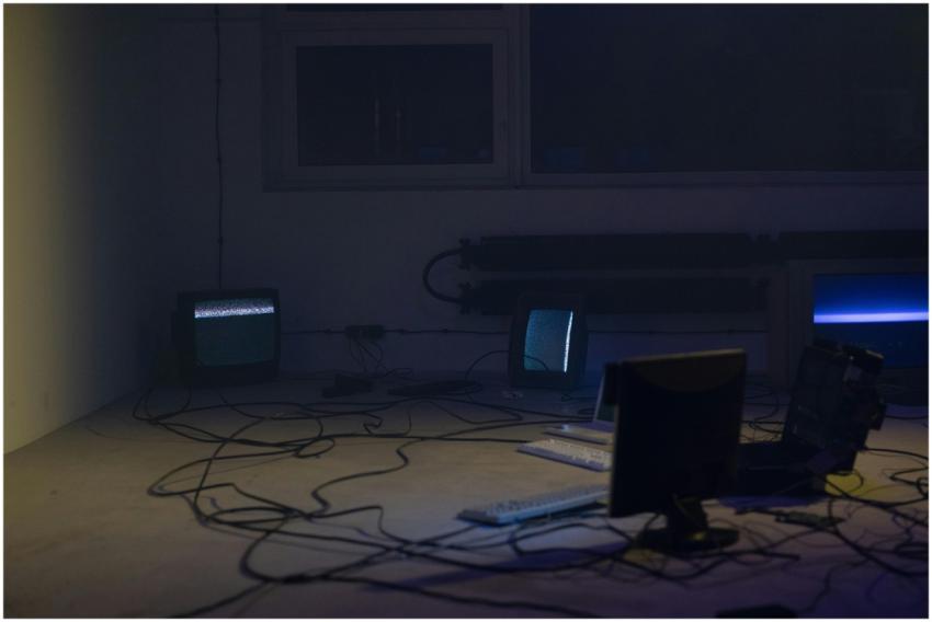 Vintage computer setup with CRT monitors, keyboard