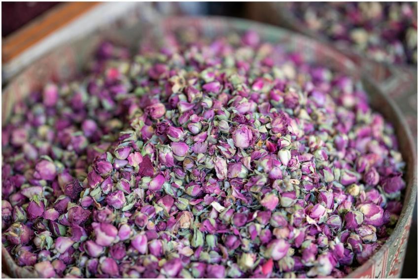 Aromatic pink rose buds piled in a bowl, perfect f