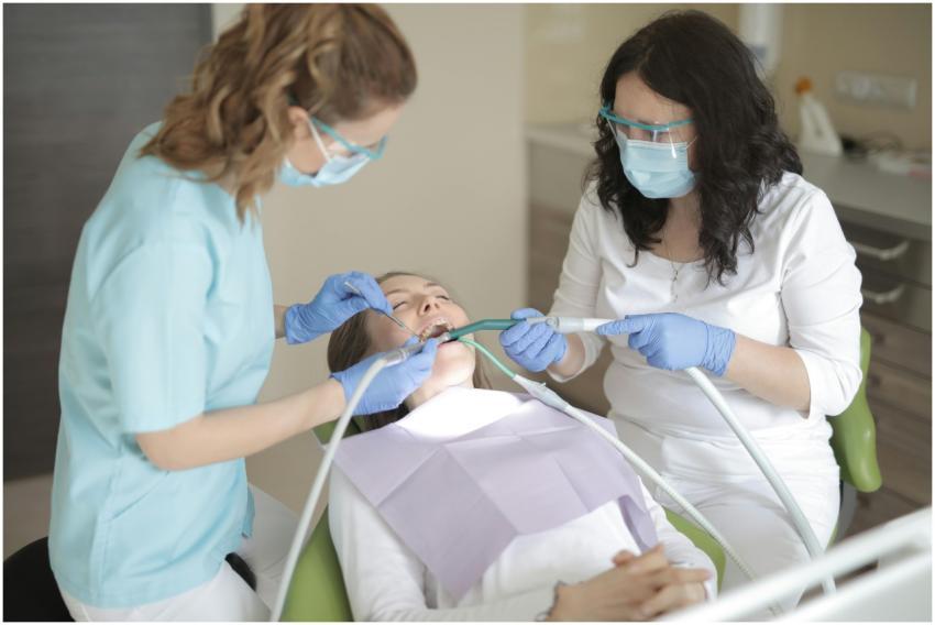 Dentists providing professional dental care to a p