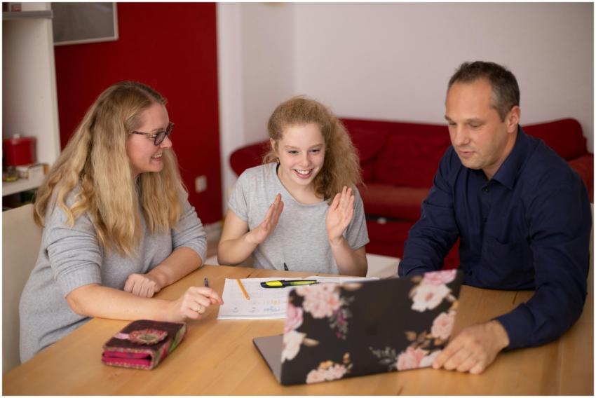 A family happily engaged in remote learning at hom