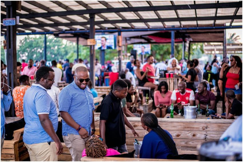 Vibrant outdoor social scene with diverse crowd in