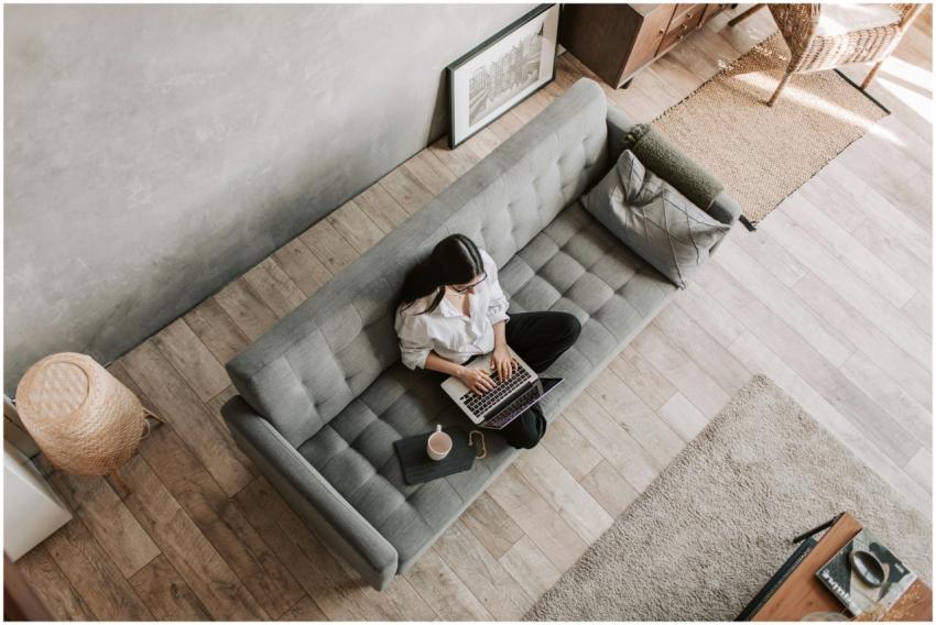 High angle view of a woman working on a laptop whi