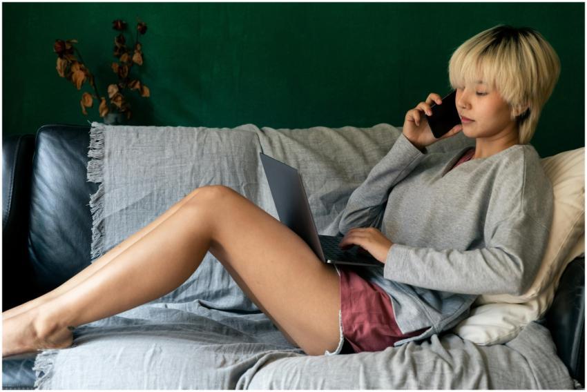 Side view of young ethnic female remote employee s