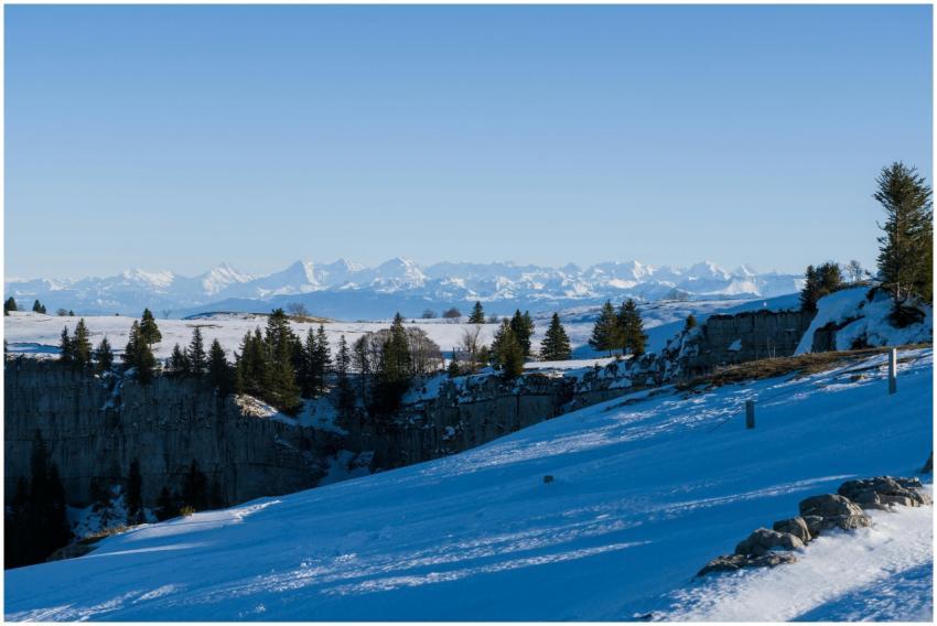 Breathtaking landscape of Creux du Van with snow-c