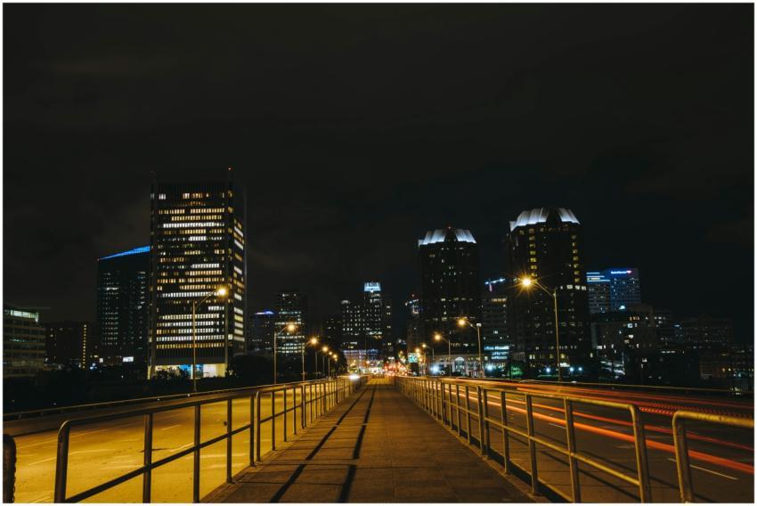 A stunning view of an urban cityscape at night wit
