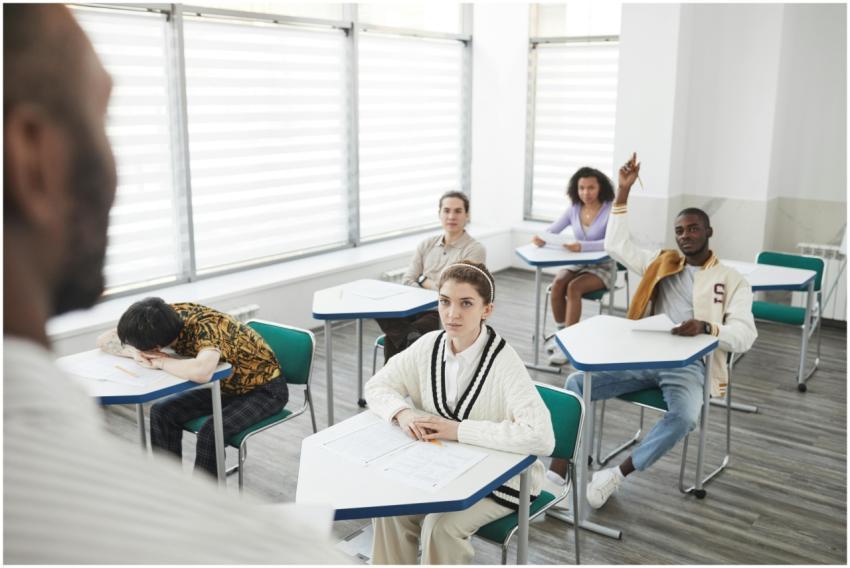 Students attending an exam in a modern classroom s