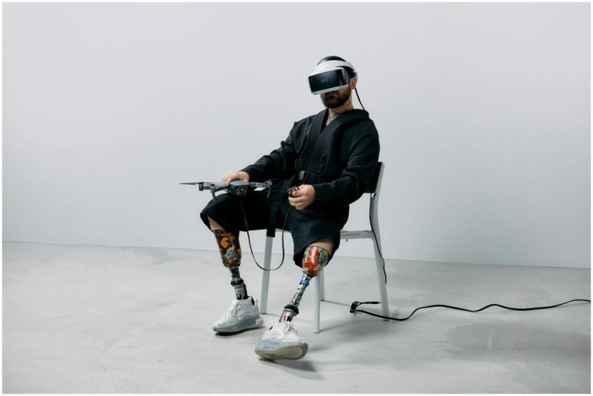 Amputee man using VR headset with prosthetic legs,