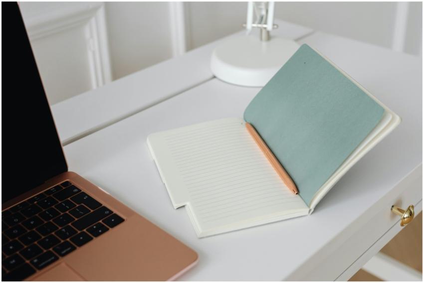 Minimalist workspace with an open notebook, pen, a