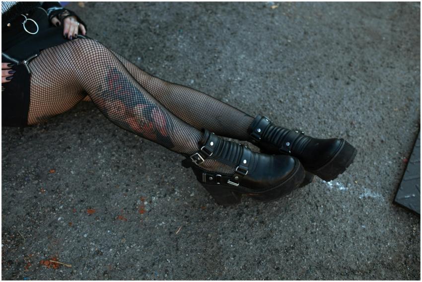 Close-up of a person's legs in fishnet stockings a